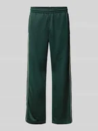 Spodnie sportowe męskie - Spodnie dresowe o luźnym kroju z mieszanki bawełny - miniaturka - grafika 1