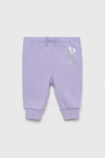 Spodnie i spodenki dla dziewczynek - GAP spodnie dresowe niemowlęce x Disney kolor fioletowy z nadrukiem - Gap - grafika 1
