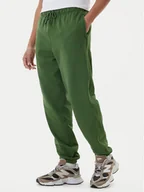 Spodnie sportowe męskie - New Balance Spodnie dresowe MP41508 Zielony Relaxed Fit - miniaturka - grafika 1