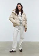 Kurtki damskie - Stradivarius Pikowana kurtka oversize z Kapturem Szary S - miniaturka - grafika 1