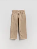 Spodnie i spodenki dla chłopców - Reserved - Wysokoelastyczne spodnie regular - beżowy - miniaturka - grafika 1