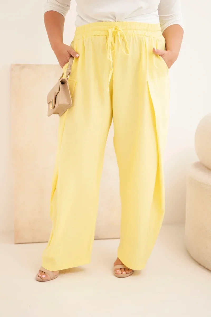 Spodnie damskie bawełniane Plus Size z gumką w pasie żółte Żółty