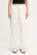 Spodnie sportowe damskie - Calvin Klein Jeans spodnie bawełniane damskie kolor beżowy szerokie high waist LV044C403G - miniaturka - grafika 1