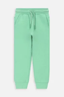 Spodnie i spodenki dla dziewczynek - Coccodrillo spodnie dresowe bawełniane dziecięce kolor zielony gładkie - grafika 1