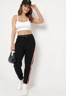 Spodnie damskie - Czarne Spodnie Dresowe z Lampasem i Ozdobnym Napisem Adkarsa - miniaturka - grafika 1