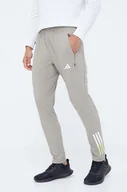 Spodnie męskie - adidas Performance spodnie treningowe Train Icons kolor zielony z nadrukiem - miniaturka - grafika 1