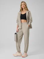 Spodnie sportowe damskie - 4F Spodnie z szerokimi nogawkami z modalem damskie - beżowe XXL - miniaturka - grafika 1