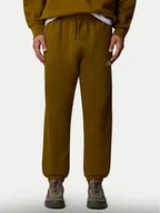 Spodnie sportowe męskie - The North Face Spodnie dresowe Essential NF0A8A6J Zielony Relaxed Fit - miniaturka - grafika 1