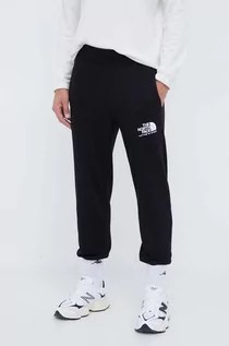 Spodnie męskie - The North Face spodnie dresowe bawełniane kolor czarny z nadrukiem - grafika 1