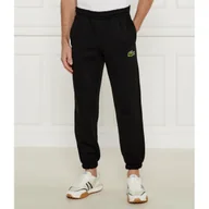 Dresy damskie - Lacoste Spodnie dresowe Relaxed fit - miniaturka - grafika 1