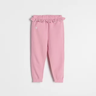 Spodnie i spodenki dla dziewczynek - Reserved Spodnie z falbanką - Różowy - grafika 1