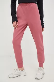 Spodnie damskie - Outhorn spodnie dresowe damskie kolor różowy gładkie - grafika 1