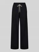 Spodnie sportowe damskie - Spodnie dresowe z szeroką nogawką i paskami w kontrastowym kolorze - miniaturka - grafika 1