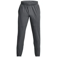 Spodnie sportowe męskie - Męskie spodnie dresowe Under Armour Stretch Woven CW Jogger Rozmiar: M / Kolor: szary - miniaturka - grafika 1