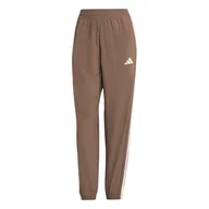 Spodnie rowerowe - adidas Kobiety Train Essentials 3-Stripes Woven Pants, Earth Strata/White, XXL - miniaturka - grafika 1