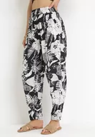 Spodnie damskie - Czarne Spodnie z Gumką w Pasie z Wiskozy w Roślinny Print Daffodi - miniaturka - grafika 1