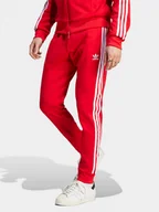 Spodnie sportowe męskie - adidas Spodnie dresowe adicolor Classics SST IM4543 Czerwony Slim Fit - miniaturka - grafika 1