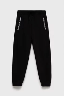 Spodnie damskie - Calvin Klein Jeans Jeans Spodnie dziecięce kolor czarny z nadrukiem - grafika 1