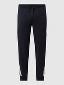 Spodnie sportowe męskie - Spodnie z dzianiny dresowej z wpuszczanymi kieszeniami - miniaturka - grafika 1