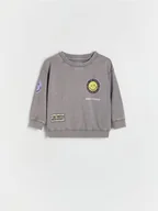 Bluzki dla niemowląt - Reserved - Bawełniany longsleeve Smiley - ciemnoszary - miniaturka - grafika 1