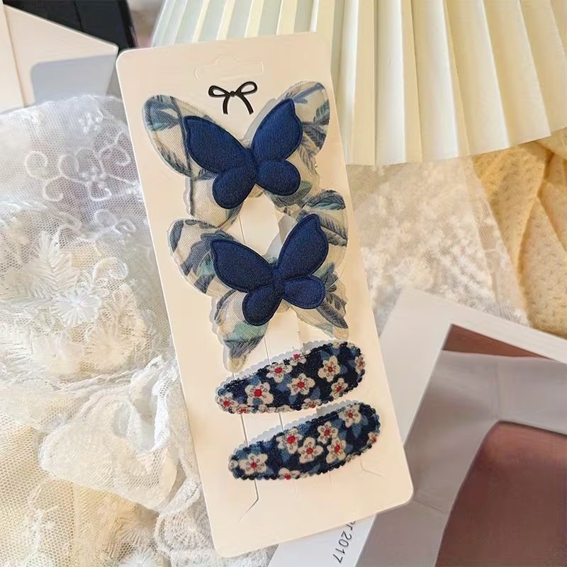 Spinki do włosów z motywem fantasy z kwiatami i motylami niebieski