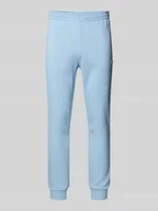 Spodnie sportowe męskie - Spodnie dresowe o kroju slim fit z naszywką z logo - miniaturka - grafika 1