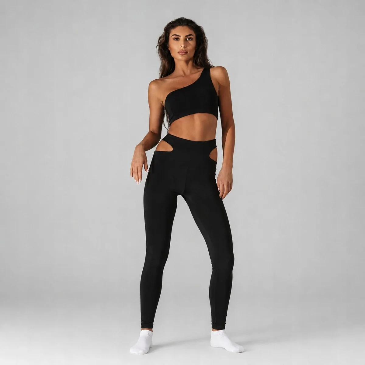 [r. XS/S] Komplet damski sportowy top legginsy z wycięciami czarny
