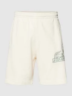 Spodnie sportowe męskie - Szorty z dzianiny dresowej z wpuszczanymi kieszeniami - grafika 1