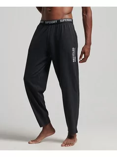 Spodnie sportowe męskie - Superdry Spodnie dresowe w kolorze ciemnoszarym - grafika 1