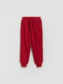 Spodnie i spodenki dla chłopców - Reserved - Bawełniane spodnie jogger - czerwony - miniaturka - grafika 1