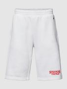 Spodnie sportowe męskie - Spodnie dresowe z wyhaftowanym logo — Champion x Stranger Things - miniaturka - grafika 1
