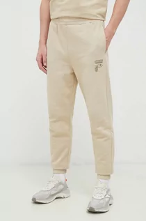 Spodnie męskie - Fila spodnie dresowe bawełniane kolor beżowy gładkie - grafika 1