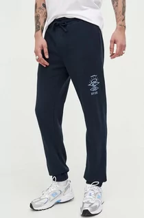 Spodnie męskie - Rip Curl spodnie dresowe kolor granatowy z nadrukiem - grafika 1