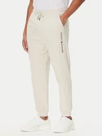Spodnie sportowe męskie - Tommy Hilfiger Spodnie dresowe UM0UM03664 Écru Regular Fit - miniaturka - grafika 1