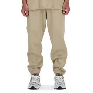 Spodnie sportowe męskie - Spodnie New Balance MP41508SOT - beżowe - grafika 1