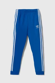 Spodnie i spodenki dla dziewczynek - adidas Originals spodnie dresowe dziecięce kolor niebieski wzorzyste - grafika 1