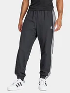 Spodnie sportowe męskie - adidas Spodnie dresowe Adicolor Woven Firebird IT2501 Czarny Regular Fit - miniaturka - grafika 1