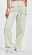 Dresy damskie - Spodnie Dresowe Damskie Szerokie Nike Sportswear Cargo FN7696-020 r. XS - miniaturka - grafika 1