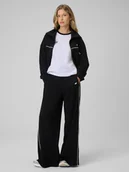 Spodnie sportowe damskie - 4F Spodnie dresowe z szerokimi nogawkami damskie - czarne XL - miniaturka - grafika 1