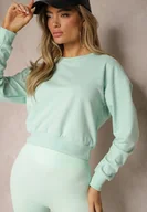 Bluzy damskie - Miętowa Bluza z Bawełną ze Ściągaczami przy Rękawach i w Pasie Alberia - Renee - miniaturka - grafika 1