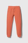 Spodnie i spodenki dla dziewczynek - Guess spodnie dresowe dziecięce kolor pomarańczowy gładkie - miniaturka - grafika 1