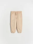 Spodenki dla niemowląt - Reserved - Bawełniane joggery - beżowy - miniaturka - grafika 1