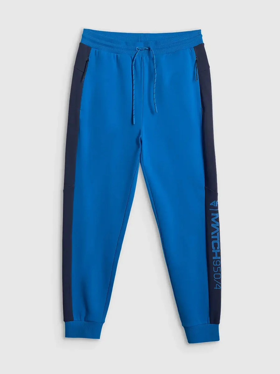 Spodnie dresowe joggery z nadrukiem męskie niebieskie 4F 2XL Niebieski