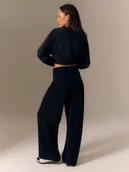 Spodnie sportowe damskie - 4F Spodnie dresowe z szerokimi nogawkami damskie - czarne XS - miniaturka - grafika 1