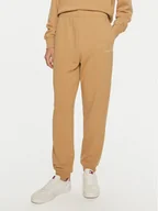 Spodnie sportowe damskie - Tommy Hilfiger Spodnie dresowe WW0WW42883 Beżowy Regular Fit - miniaturka - grafika 1