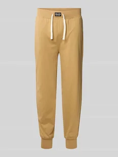 Spodnie sportowe z elastycznym pasem i detalem z logo - Piżamy męskie - miniaturka - grafika 1