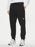 Spodnie sportowe męskie - The North Face Spodnie dresowe Nse Light NF0A4T1F Czarny Regular Fit - miniaturka - grafika 1