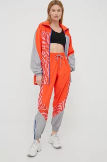 Spodnie damskie - Adidas by Stella McCartney by Stella McCartney spodnie dresowe damskie kolor pomarańczowy wzorzyste - grafika 1