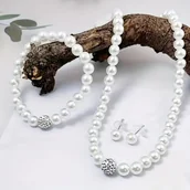 Inne - TEMU Elegancki Zestaw Biżuterii z Sztucznymi Perłami dla Kobiet - Zawiera Naszyjnik, Bransoletkę i Kolczyki Idealny na Przyjęcia i Bankiety - miniaturka - grafika 1