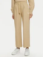 Spodnie sportowe damskie - Puma Spodnie dresowe Her 676007 Beżowy Relaxed Fit - miniaturka - grafika 1